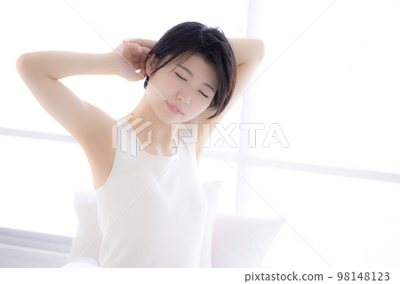 Lifestyle young woman stretching Lifestyle young woman stretching 98148123