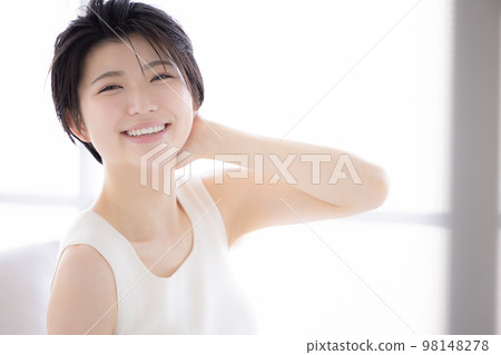 Beauty image Young woman relaxing in pajamas Beauty image Young woman relaxing in pajamas 98148278