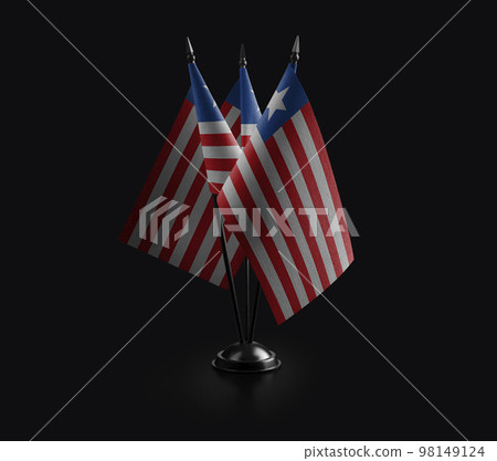 Small national flags of the Liberia on a black background 98149124