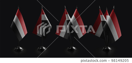 Small national flags of the Yemen on a black background Small national flags of the Yemen on a black background 98149205