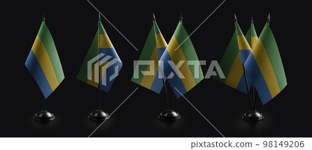 Small national flags of the Gabon on a black background 98149206