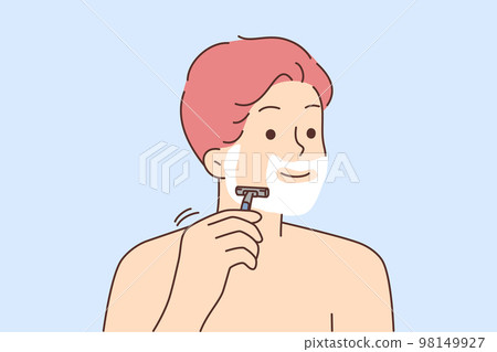 Smiling man shaving with razor 98149927