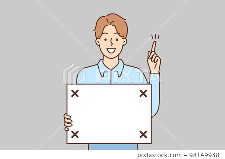 Smiling man with board in hands point up Smiling man with board in hands point up 98149938