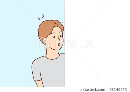 Astonished man feel frustrated looking from around corner Astonished man feel frustrated looking from around corner 98149953