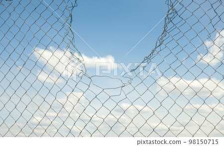 Broken metal mesh fence Broken metal mesh fence 98150715