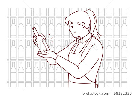 Smiling waitress choosing wine in cellar Smiling waitress choosing wine in cellar 98151336