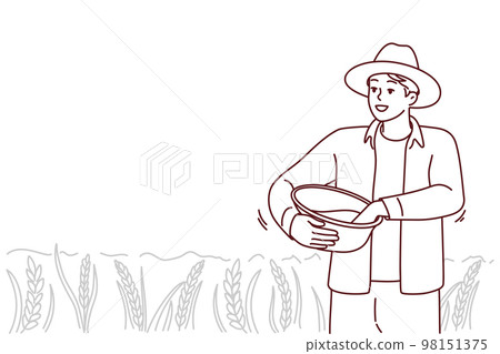 Male farmer working in field 98151375