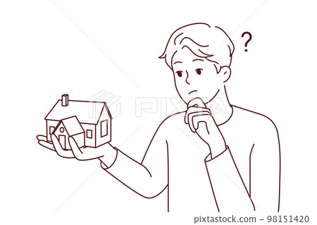 Young man thinking of house mortgage  98151420