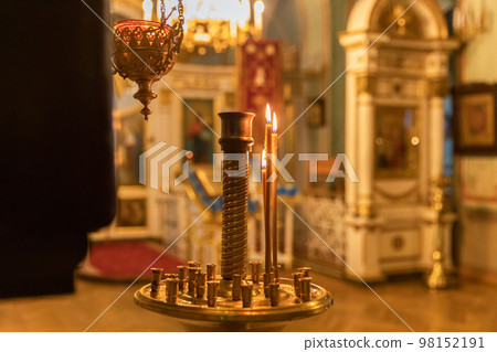 Orthodox Church. Christianity. Festive interior decoration with burning candles and icon in traditional Orthodox Church on Easter Eve or Christmas. Religion faith pray symbol 98152191
