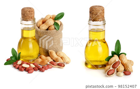 peanut oil in a glass bottle with peanuts in bag 98152407