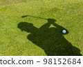 Close up Shadow of a golfer on the field on green grass. 98152684