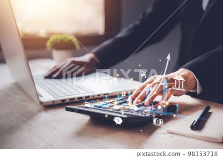 Individual income tax paid and corporations concept. Shopping online, Businessman using a calculator and laptop (notebook) of Data analysis, Paperwork, financial research, and report. 98153718