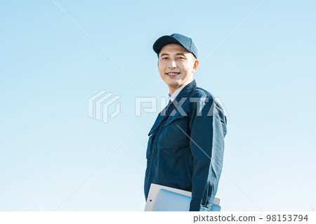 Outdoor portrait of a man in work clothes Outdoor portrait of a man in work clothes 98153794