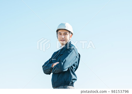 Outdoor portrait of a man in work clothes 98153796