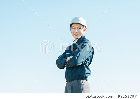 Outdoor portrait of a man in work clothes Outdoor portrait of a man in work clothes 98153797