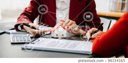 Salesman Hands On House Model , Small Toy House Small Mortgage Property insurance and concepts real estate. Salesman Hands On House Model , Small Toy House Small Mortgage Property insurance and concepts real estate. 98154165