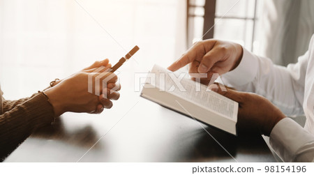 Woman's hand with cross .Concept of hope, faith, christianity, religion, church and pray to God. on the table. 98154196