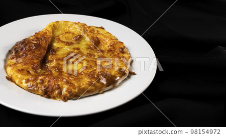 Baked khachapuri on white plate Baked khachapuri on white plate 98154972