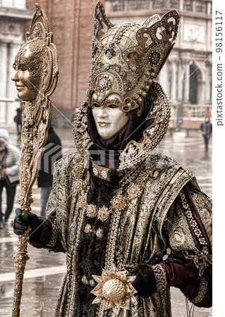 Colorful carnival masks at a traditional festival in Venice, Italy 98156117