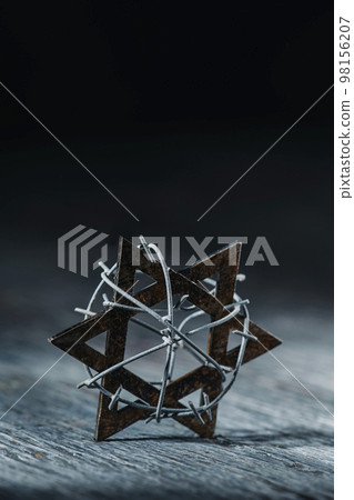 old star of david tied with some barbed wire old star of david tied with some barbed wire 98156207