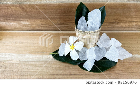 Crystal clear alum cubes or Potassium alum in small wooden dish chemical compound substance concept for beauty spa and underarm treatment industrial Crystal clear alum cubes or Potassium alum in small wooden dish chemical compound substance concept for beauty spa and underarm treatment industrial 98156970