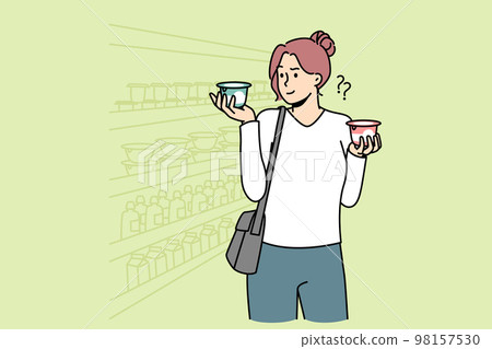 Young woman choose dairy product in supermarket  98157530