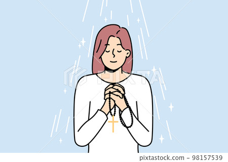 Woman with rosary praying Woman with rosary praying 98157539