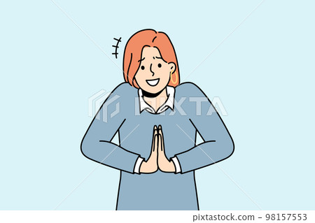Smiling woman hold hands in prayer ask for favor 98157553