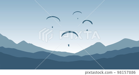 paragliding adventure flying with friends on blue mountain background at sunset paragliding adventure flying with friends on blue mountain background at sunset 98157886