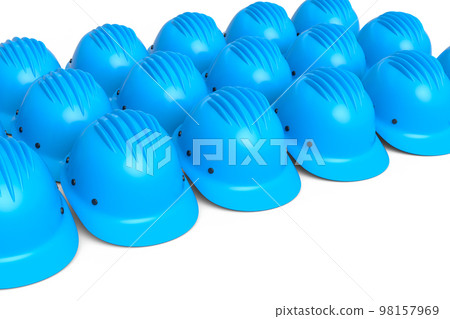 Set of safety helmets or hard caps for carpentry work in row on yellow 98157969