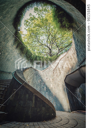 Spiral staircase at daytime in Fort Canning Park, Singapore Spiral staircase at daytime in Fort Canning Park, Singapore 98158845