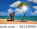 Two coconut palm tree cross on the tropical beach at daytime 98158969