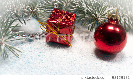 New Year's photo branch ate in the snow, a gift under the Christmas tree. New Year 2021 New Year's photo branch ate in the snow, a gift under the Christmas tree. New Year 2021 98159181