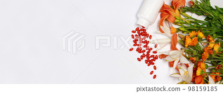 Banner with bioadditive tablets and medicinal plants with place for text copy space. Lutein, herbal medicine pills Banner with bioadditive tablets and medicinal plants with place for text copy space. Lutein, herbal medicine pills 98159185