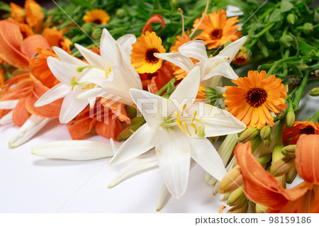 A beautiful set of flowers from white and orange lilies to collect a bouquet florist. A beautiful set of flowers from white and orange lilies to collect a bouquet florist. 98159186