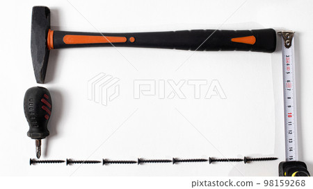 Construction tools on a white background with space for text. Hammer, self-cutters and roulette items for repair in house. Building implements. 98159268