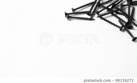 Self-cutters on a white background banner with space for text. Construction tools, self-tapping screws for fastening. Black screw hardware. Self-cutters on a white background banner with space for text. Construction tools, self-tapping screws for fastening. Black screw hardware. 98159272