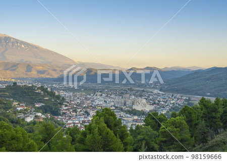 View to Berat, historic city in the south of Albania at night with all lights flashing and white houses gathering on a hill. Captured during blue hour with the sky full of stars. 98159666