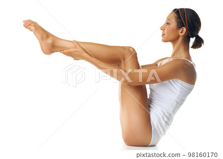 Fitness, body and legs of woman on studio floor with mockup for health, wellness and pilates workout. Training, cardio and exercise model with balance for muscle goals or results on marketing mock up Fitness, body and legs of woman on studio floor with mockup for health, wellness and pilates workout. Training, cardio and exercise model with balance for muscle goals or results on marketing mock up 98160170
