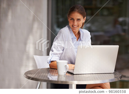 Working outside is always a pleasure. an attractive young woman using her laptop outdoors. 98160338