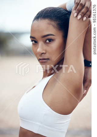 Fitness, workout and portrait of black woman stretching before marathon training or running in Jamaica. Health, wellness and sports, serious motivation to exercise for girl athlete or track runner. 98161376