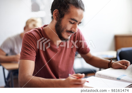 Working hard for good grades. young university students during class. 98161474