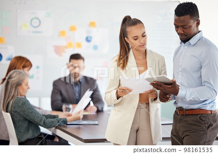 Tablet, planning and meeting with a business team at work together in a boardroom before a planning discussion. Teamwork, technology and strategy with a man and woman employee group working online 98161535