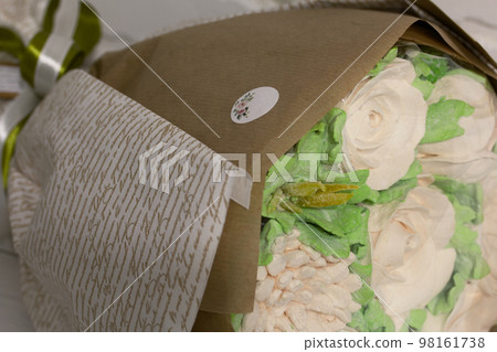 Marshmallow bouquet. Bouquet of zephyr flowers. On a white background. Close-up. 98161738