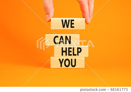 Support and we can help you symbol. Concept words We can help you on wooden blocks. Beautiful orange background. Businessman hand. Business psychological we can help you concept. Copy space. 98161773