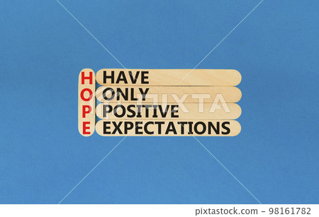 HOPE have only positive expectations symbol. Concept words HOPE have only positive expectations on stick on beautiful blue background. Business HOPE have only positive expectations concept. Copy space HOPE have only positive expectations symbol. Concept words HOPE have only positive expectations on stick on beautiful blue background. Business HOPE have only positive expectations concept. Copy space 98161782