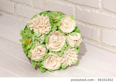 Marshmallow bouquet. Bouquet of zephyr flowers. On a white background. Close-up. Marshmallow bouquet. Bouquet of zephyr flowers. On a white background. Close-up. 98161802