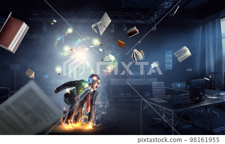 Determined businessman leaving fire trails on asphalt Determined businessman leaving fire trails on asphalt 98161955