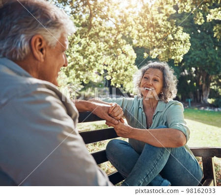 Retirement, relax and love with couple in park together for peace, happy and nature in spring. Wellness, smile and marriage with old man and woman on bench in countryside for nature, summer and date 98162033