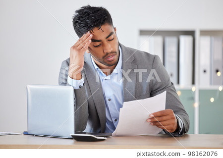 Businessman, laptop and stress with budget, paper and headache. for anxiety, headache and burnout in office. Corporate man, worker and mental health, debt and frustrated with report, mistake or tired Businessman, laptop and stress with budget, paper and headache. for anxiety, headache and burnout in office. Corporate man, worker and mental health, debt and frustrated with report, mistake or tired 98162076